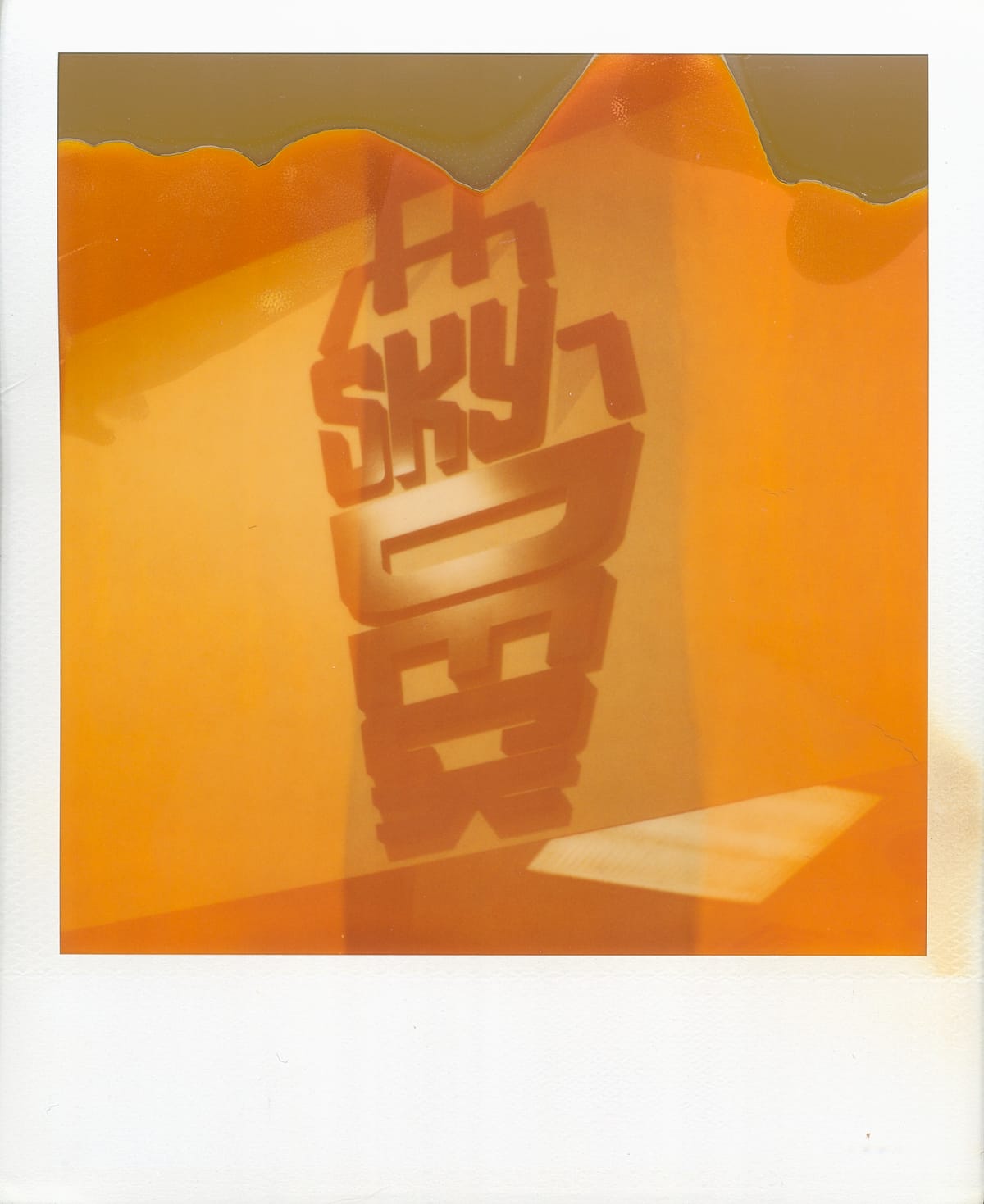 Scan of expired Polaroid film photo of the Sears Tower SkyDeck logo (Chicago, IL)