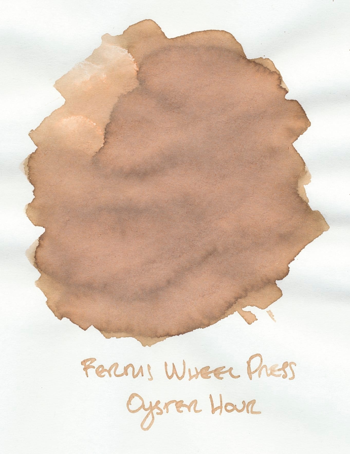 Close up of an ink swatch of Ferris Wheel Press Oyster Hour fountain pen ink, a medium-light tan color with yellow undertones