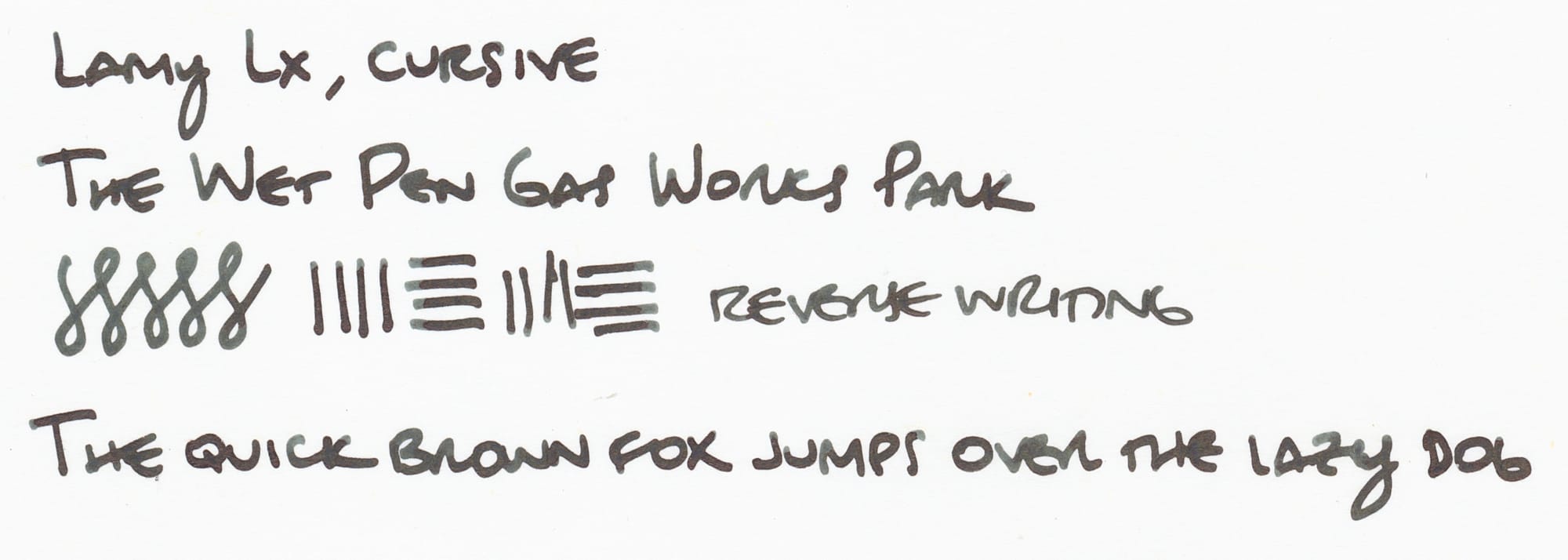 Writing sample using the grungy green-brown ink on white paper: "Lamy Lx, cursive; The Wet Pen Gas Works Park; figure eights and vertical and horizontal lines; reverse writing; The quick brown fox jumps over the lazy dog"