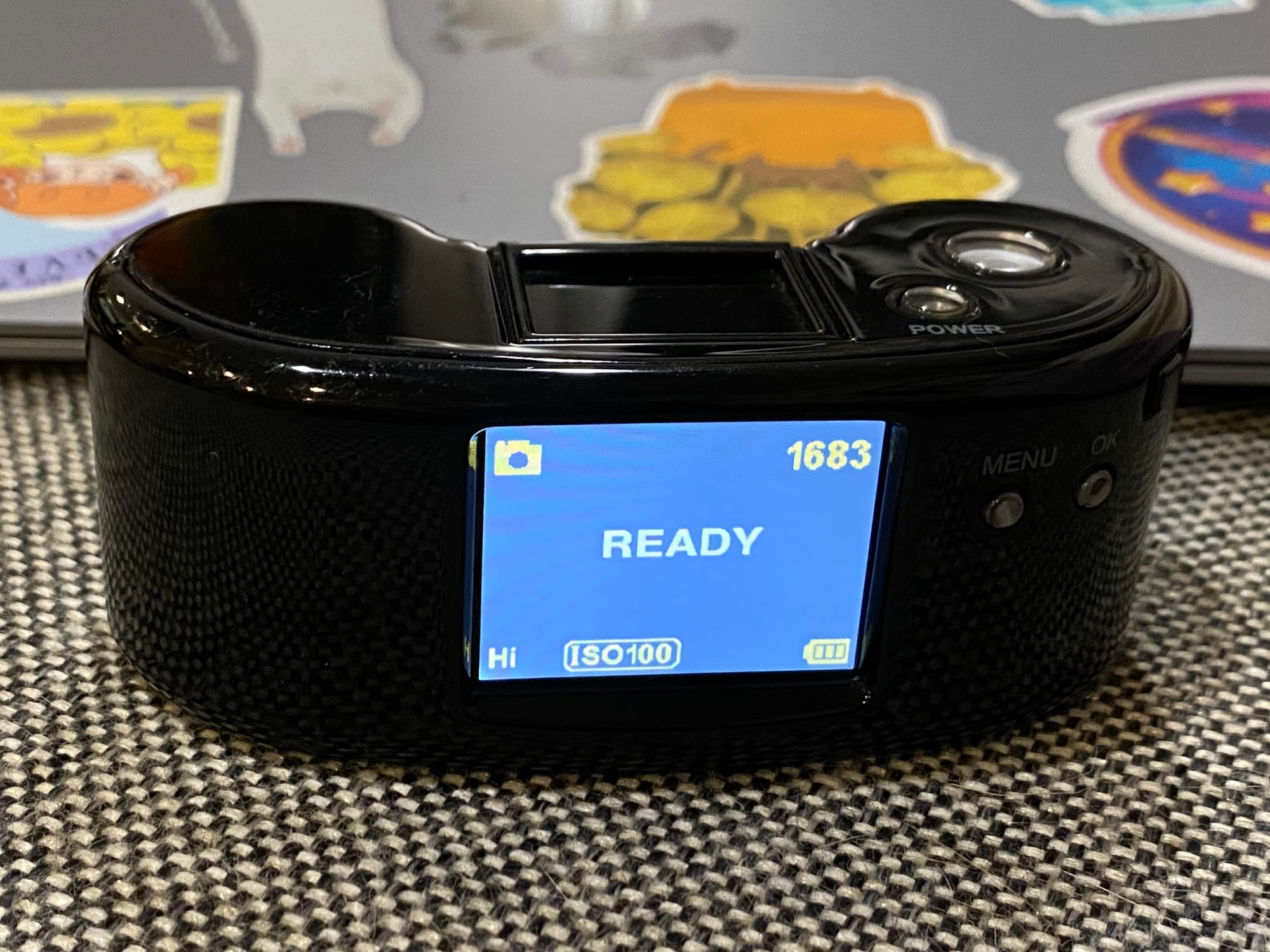 Close up of the rear of the Digital Harinezumi 2 camera, showing the small LCD with various operating info, like number of pictures that can be taken, ISO setting, battery level