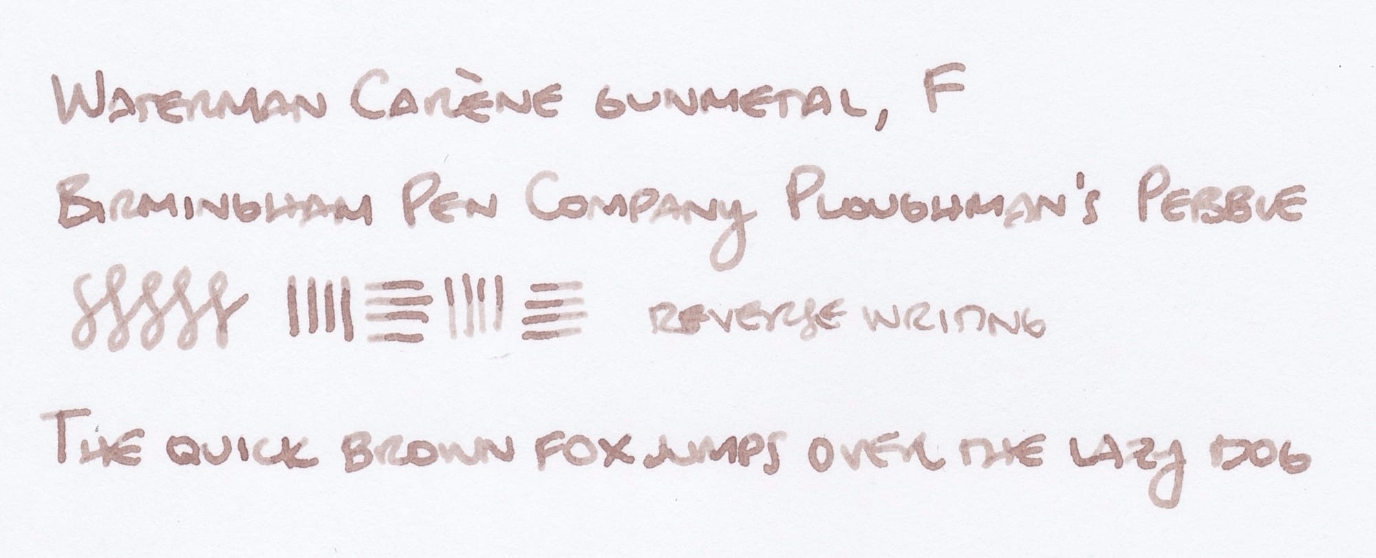 Writing sample from the Waterman Carène: "Waterman Carène gunmetal, F; Birmingham Pen Company Ploughman's Pebble; figure-8 and vertical/horizontal scribbles; reverse writing written with the reverse of the nib; The quick brown fox jumps over the lazy dog"