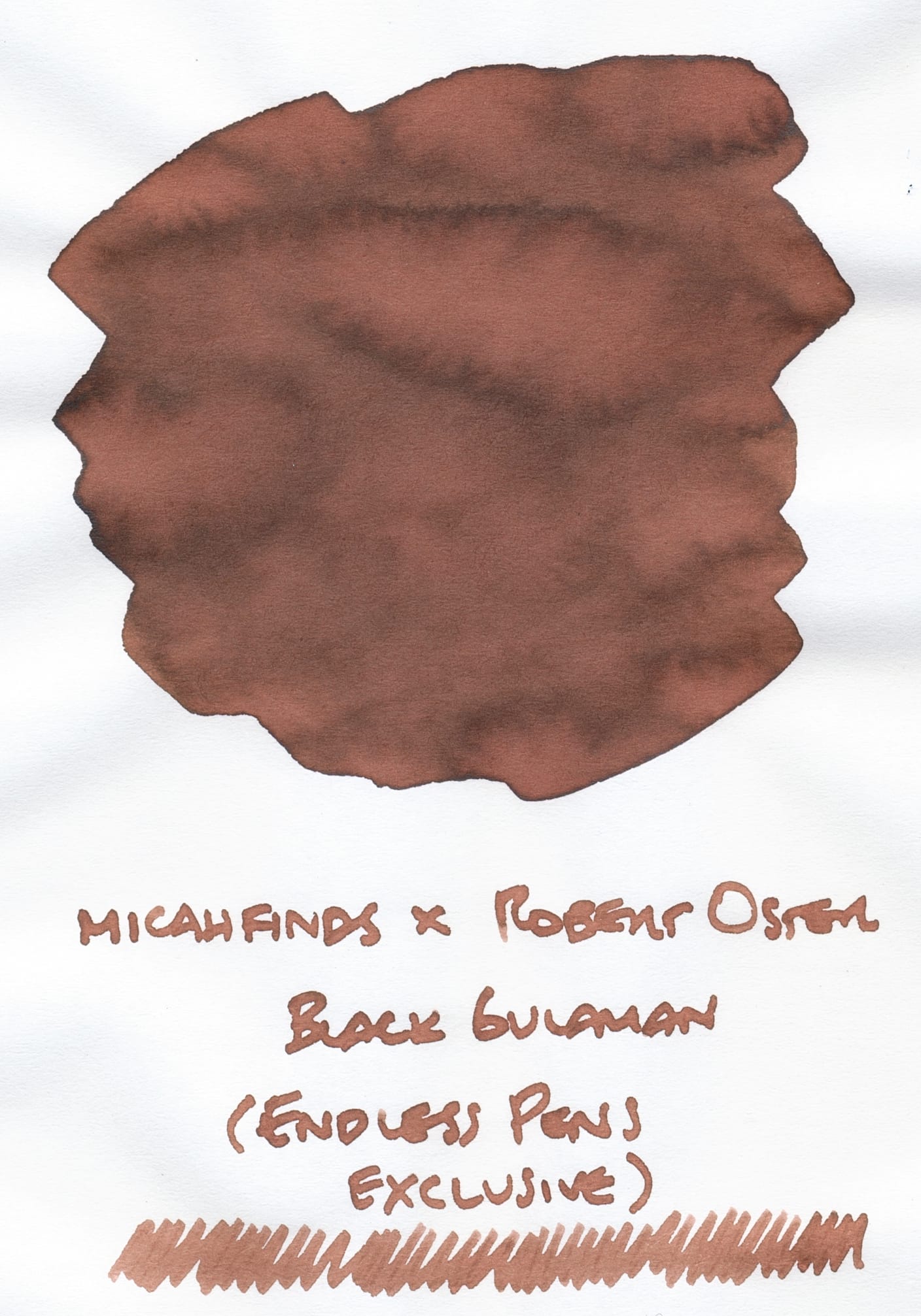 Reddish-brown fountain pen ink swatch on white paper with its name written underneath: "micahfinds x Robert Oster Black Gulaman (Endless Pens exclusive)" and a long scribble underneath the text.