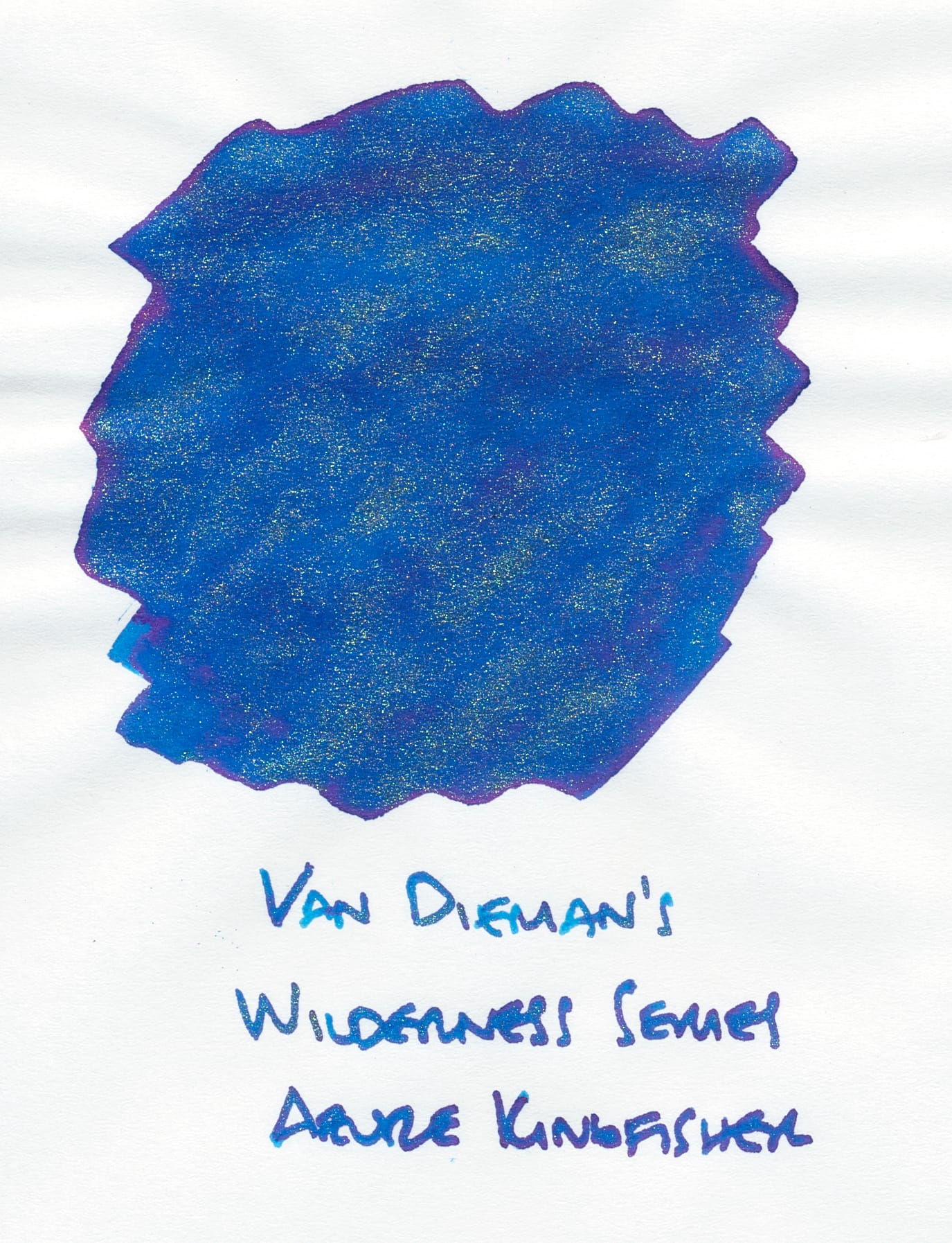 Ink swatch of another blue ink with more noticeable red sheen around the edges and gold shimmer throughout, labeled underneath "Van Dieman's Wilderness Series Azure Kingfisher"