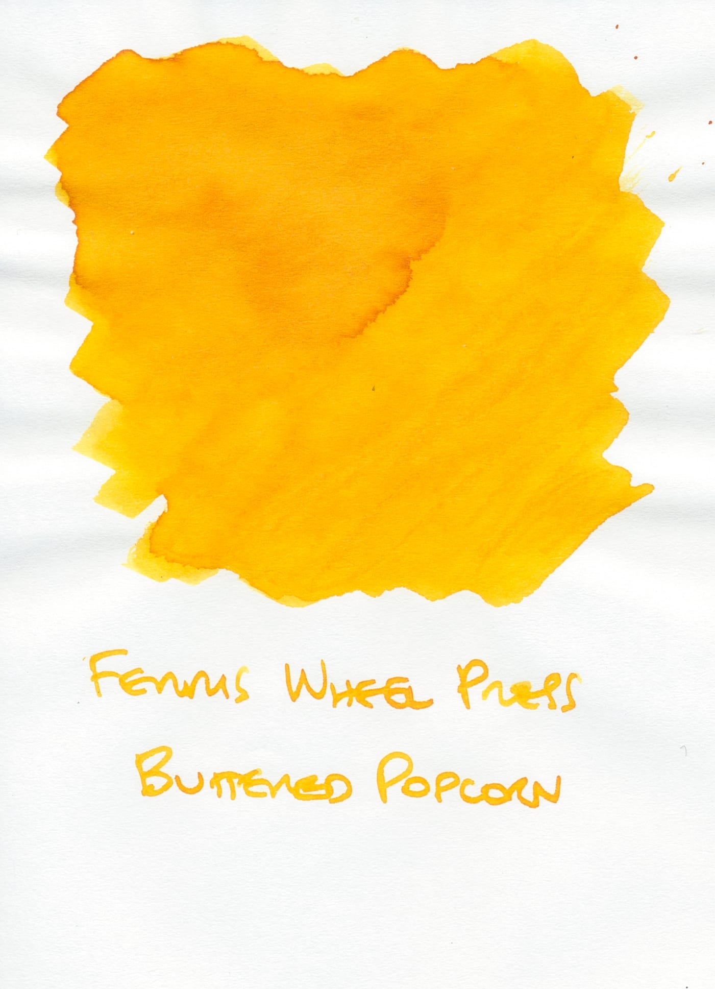 Ink swatch of a bright sunny yellow orange ink that is totally legible on white paper.