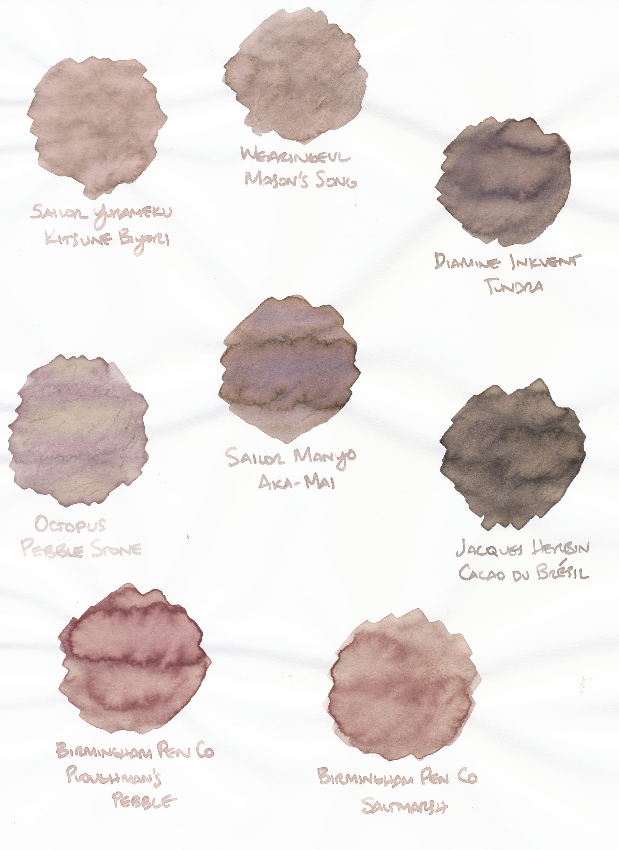 Fountain pen ink swatches on very thin paper of various beigey, neutral colors, except for two which are more saturated and brown