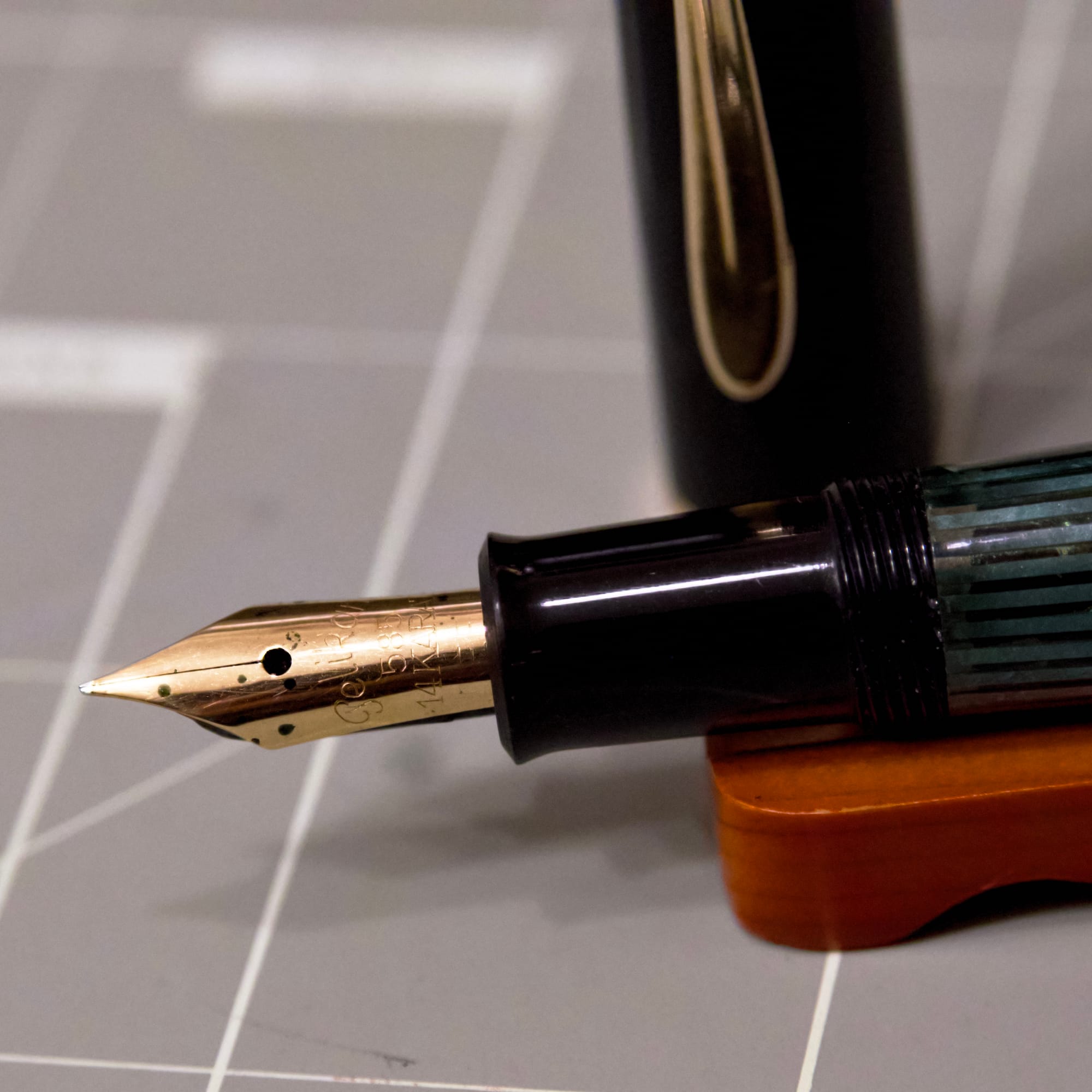 Close up of the gold nib on a Pelikan 140 fountain pen