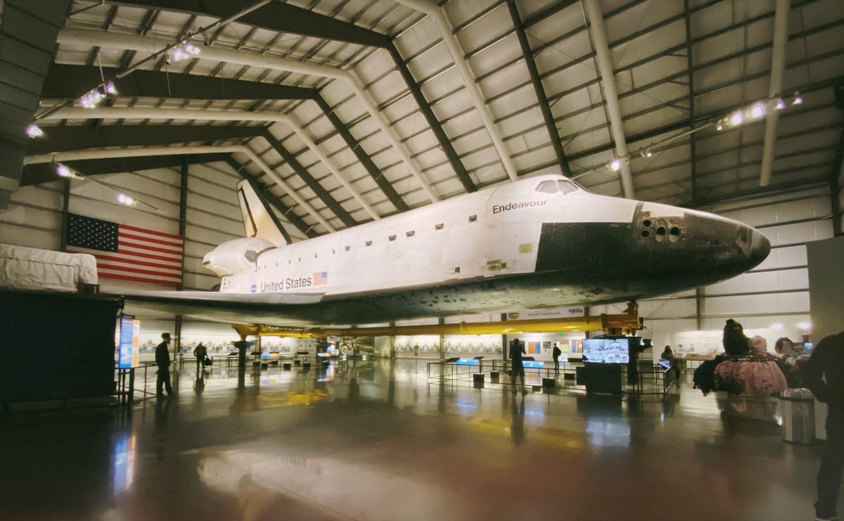 Very wide angle view of the NASA shuttle Endeavour in a hanger on display in Los Angeles