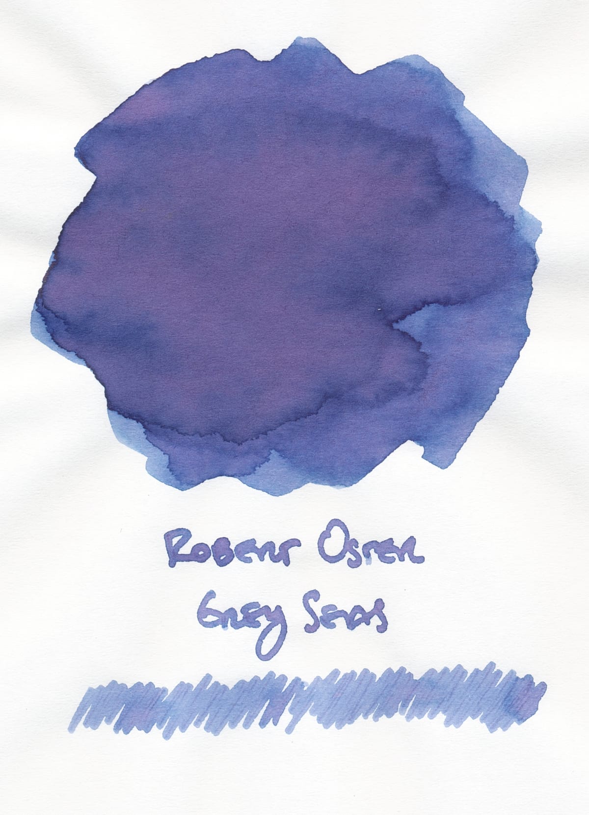 Fountain pen ink swatch of a medium blue with purple and pink tones, labeled Robert Oster Grey Seas