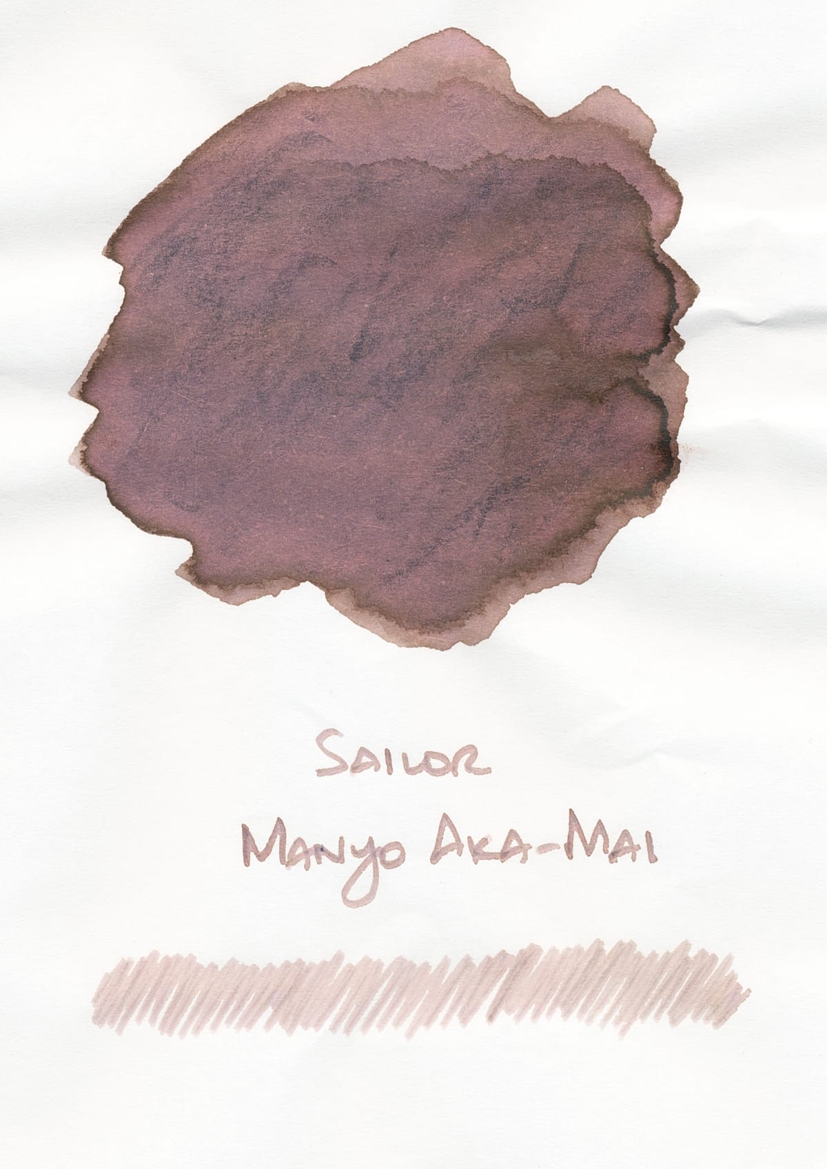 Big splotch of a rosy beige ink labeled Sailor Manyo Aka-Mai, and a scribble using the ink underneath the label